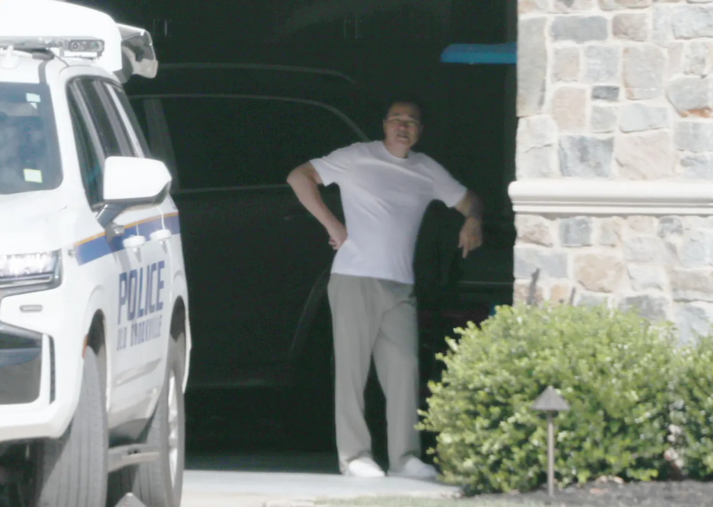 Zhu watches his Nassau County home get raided.